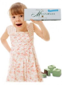 Girl smiling with box of candy