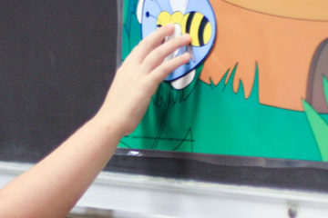 Girl Student Adding Bee to Her Artwork